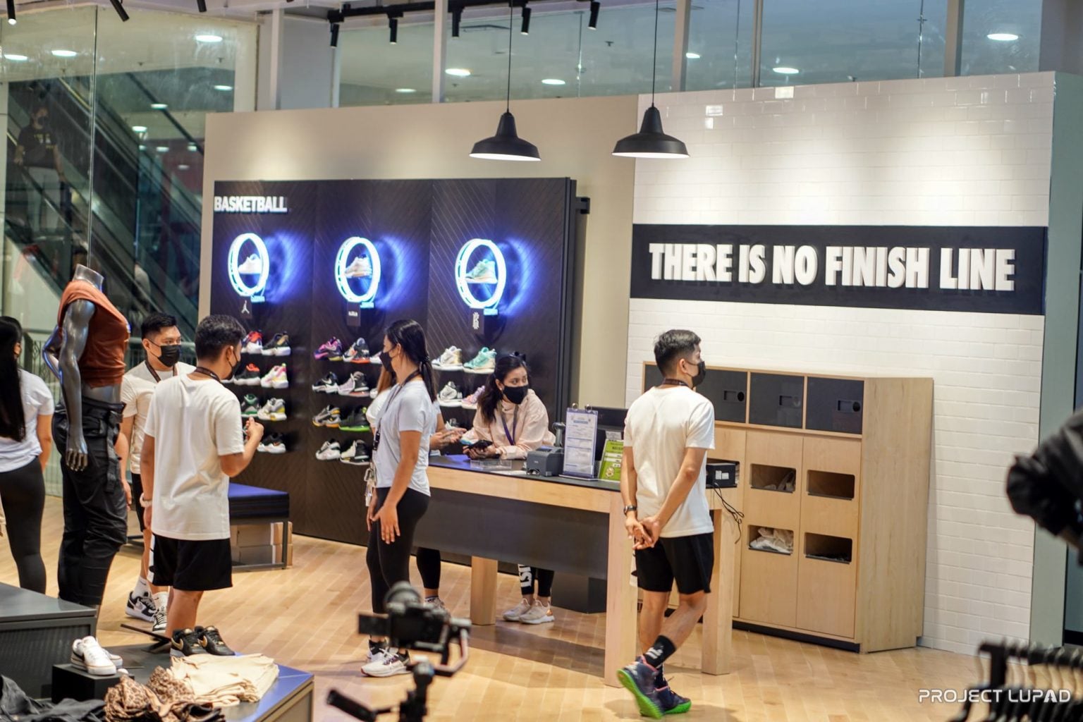 Basketball wall and There Is No Finish Line sign inside Nike CDO