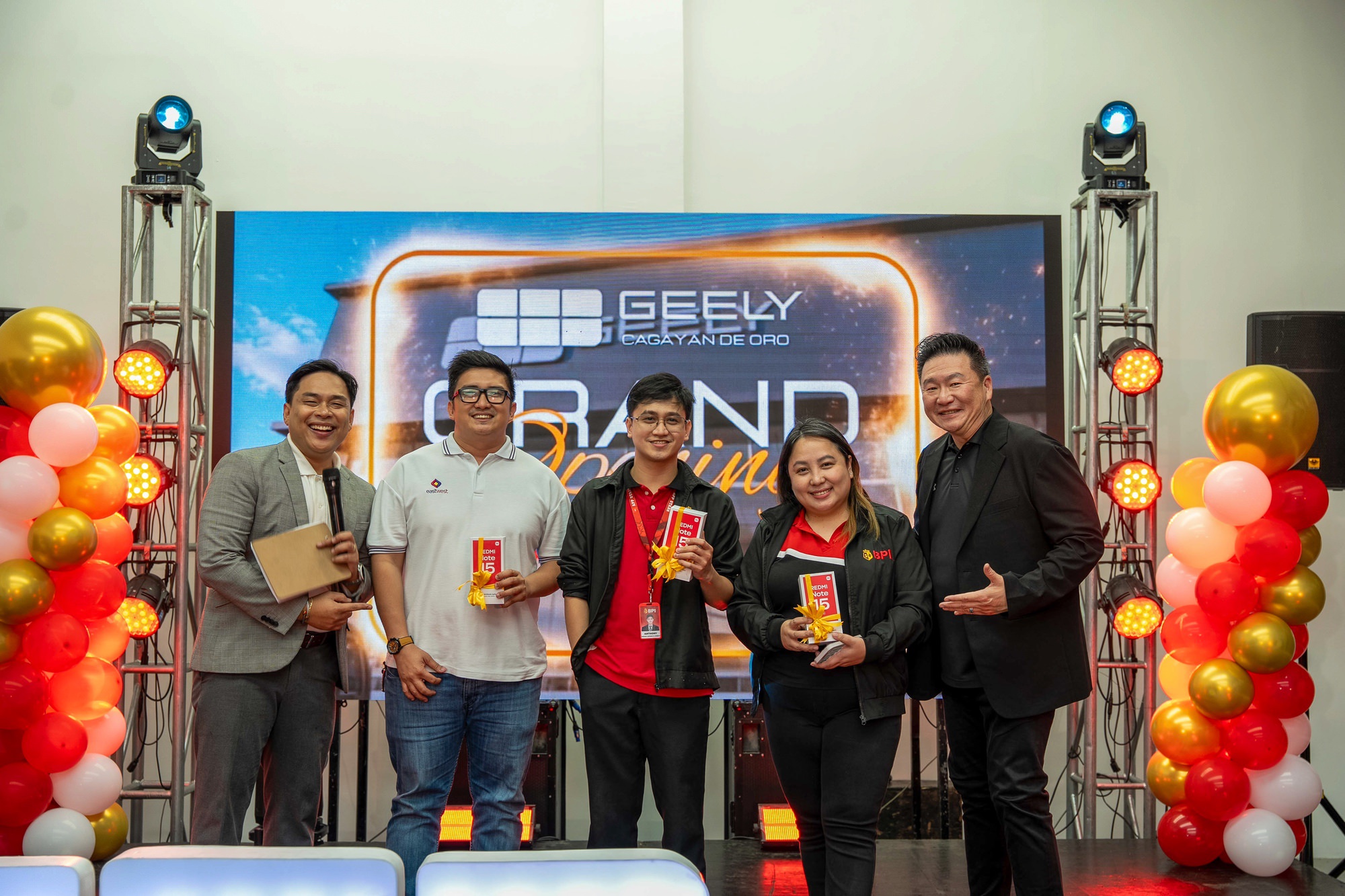 The Geely team on stage at the grand opening