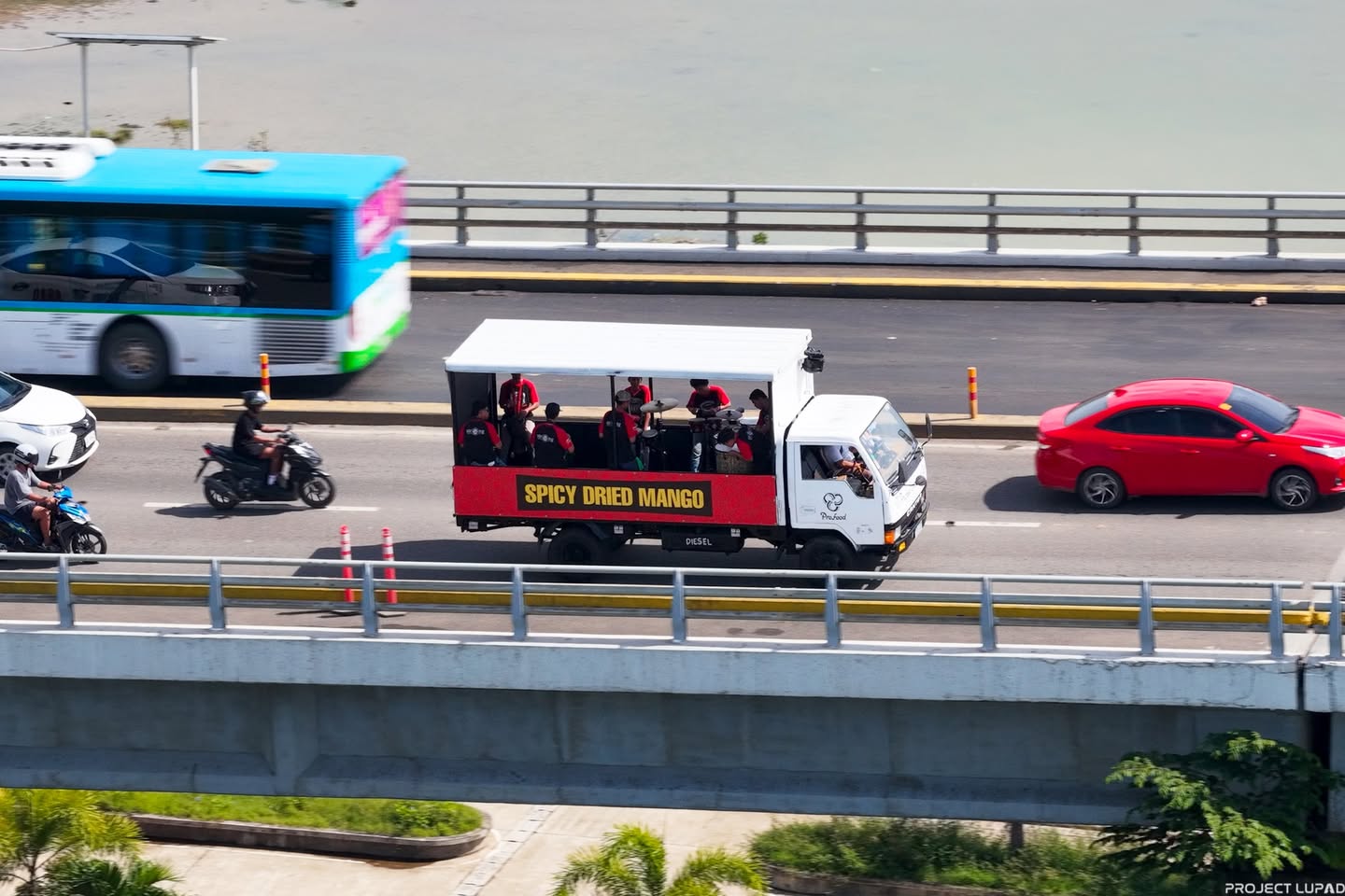 The Cebu Brand Spicy Dried Mango truck on a Cebu bridge