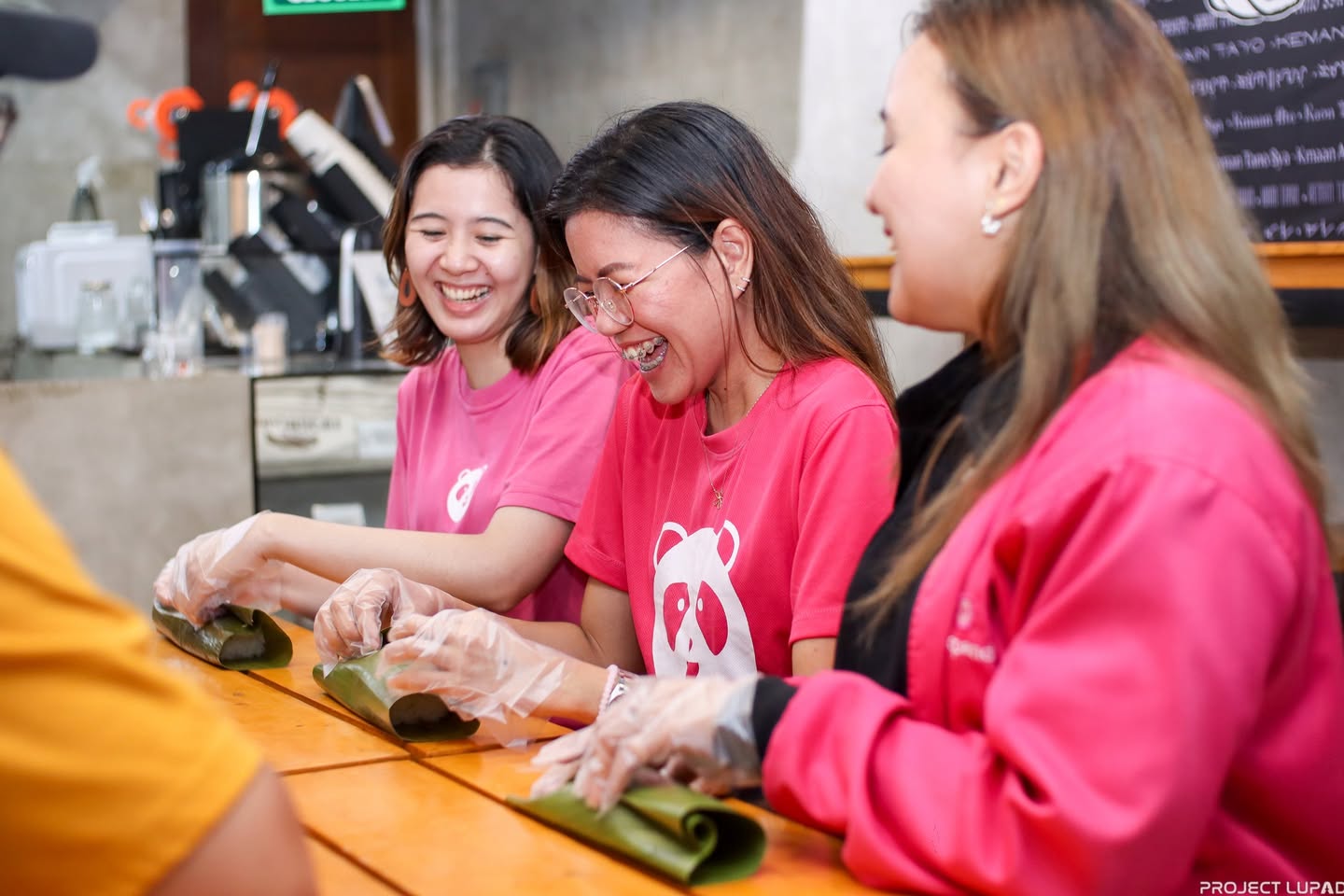 Volunteers serving pastil at Kadayawan in Davao, shot for this foodpanda case study by Project LUPAD