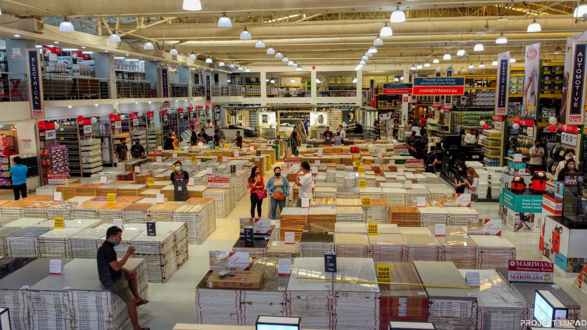 Shoppers at the opening of Handyman Bulua