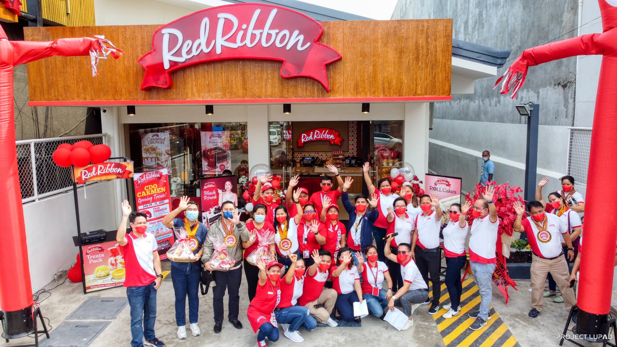 The Red Ribbon CDO Carmen team at the storefront